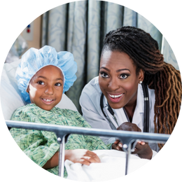 Doctor and patient smiling at camera